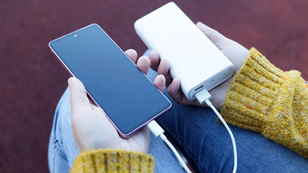 A phone charging from a power bank